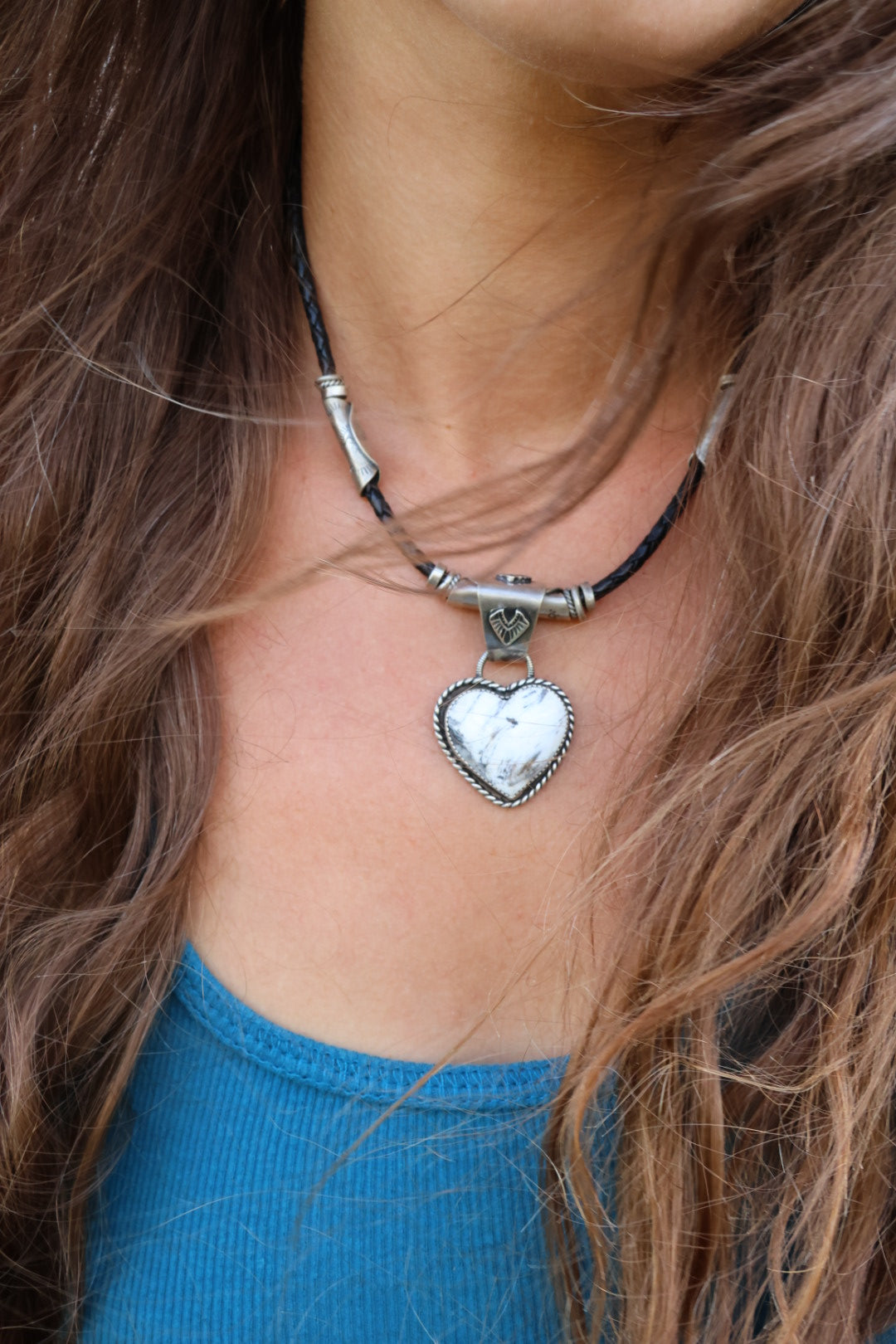 White buffalo Heart pendant on braided leather cord