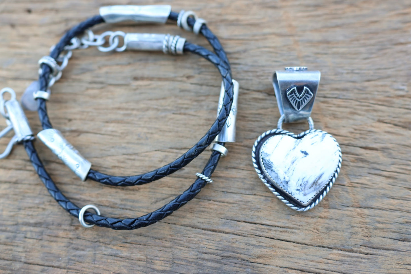 White buffalo Heart pendant on braided leather cord