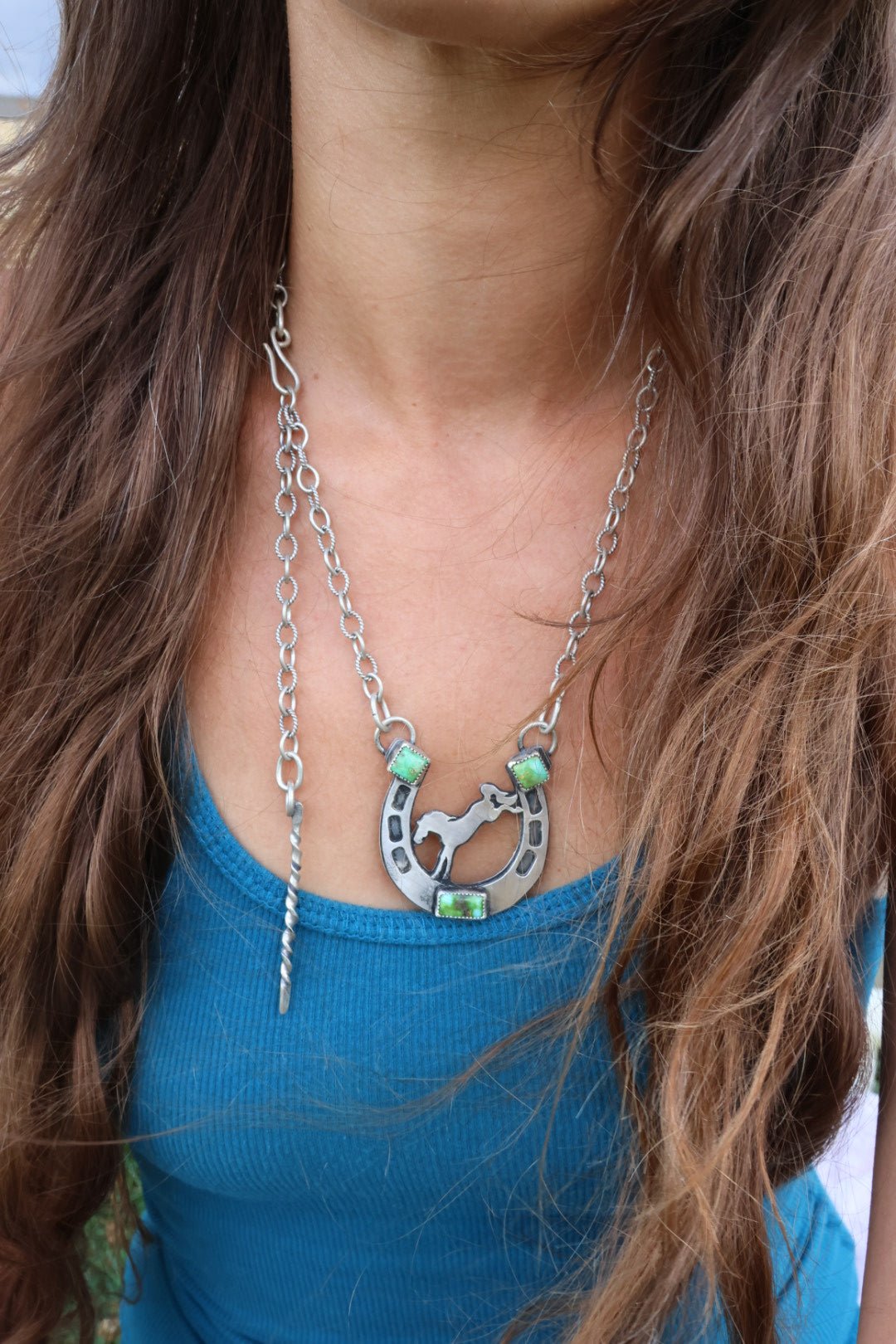 Horse shoe necklace with bucking bronco